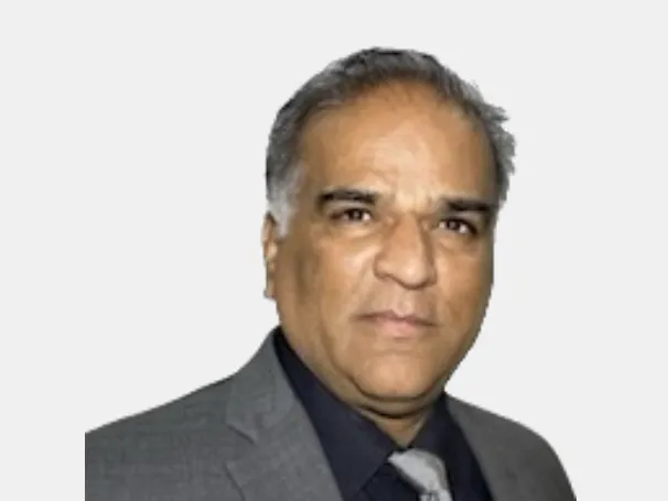 a man in a suit and tie looking at the camera