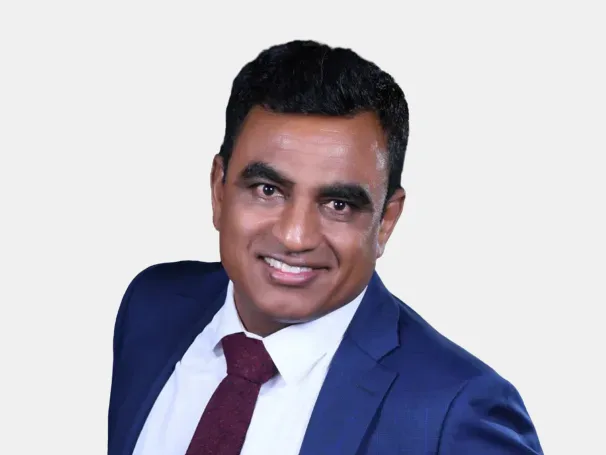 a man in a blue suit and red tie